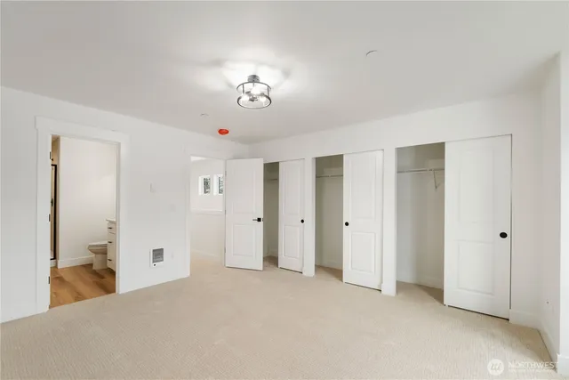 a view of a bedroom with closet area