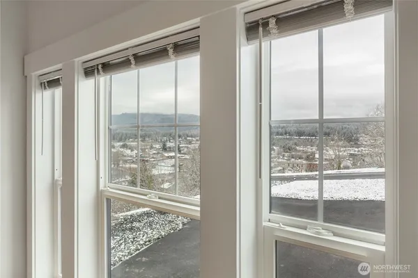 a view of a glass door and a window