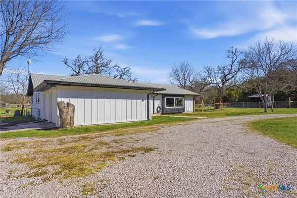 a view of a house with a big yard