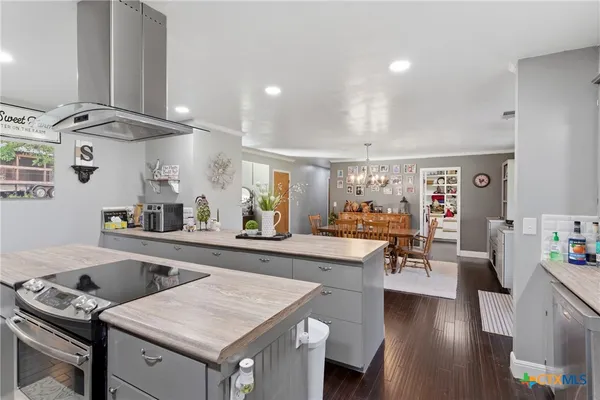 a kitchen with a table and chairs in it