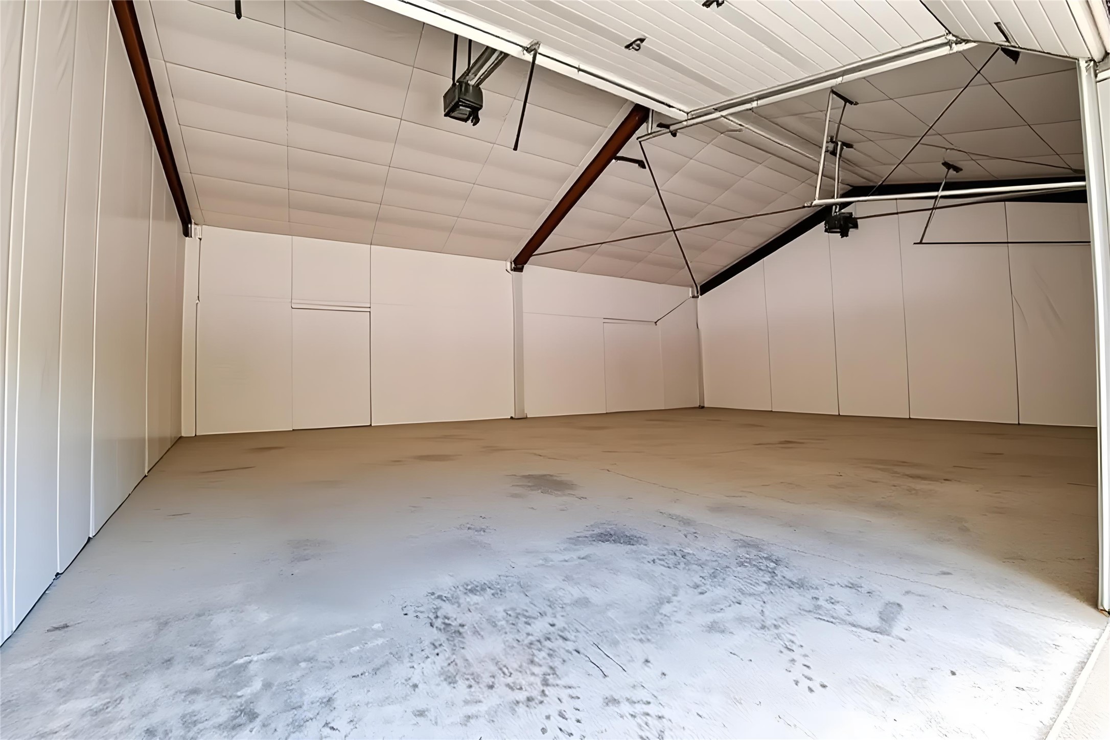 1024 Sand Hills Road Red Rock, TX 78662 - Photo 34 of 40 A spacious, clean storage shop garage with high ceilings and ample storage capacity awaits your vehicles or projects.