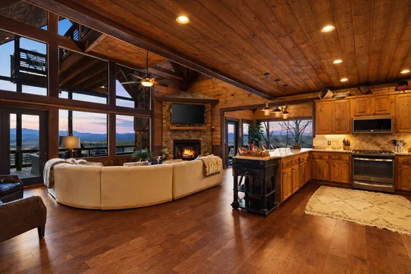 a living room with furniture and a fireplace