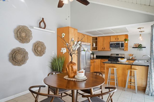 a dining room with a table and chairs