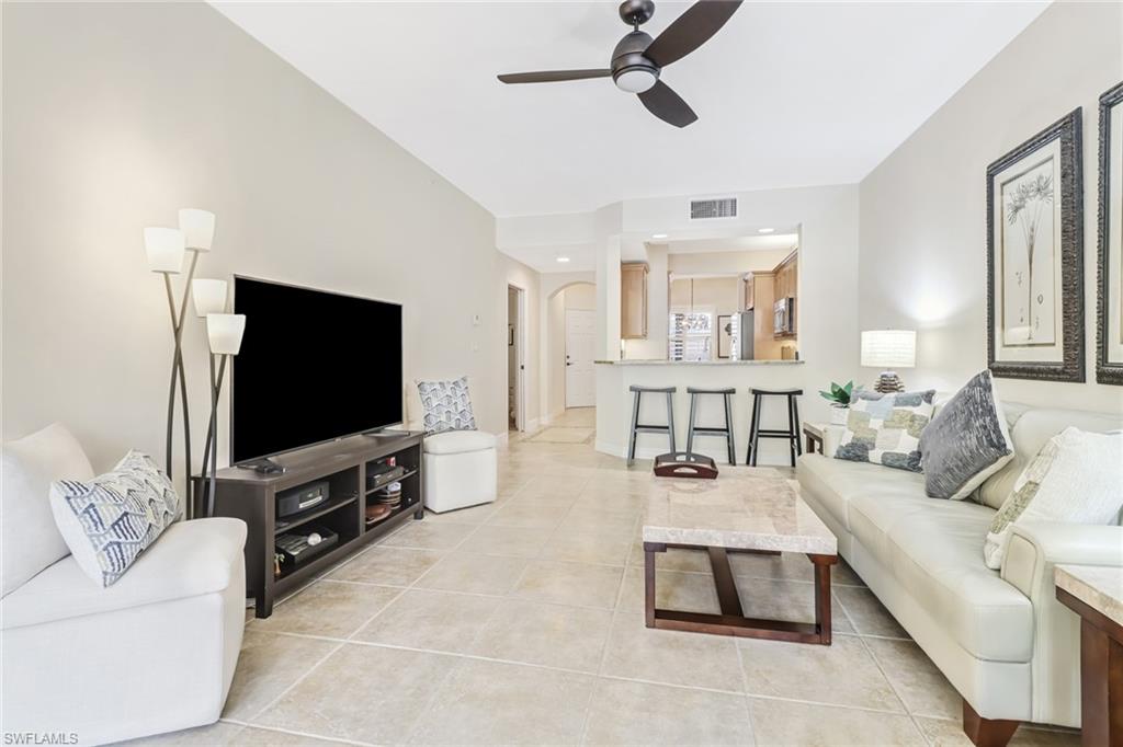 401 Bayfront Place, Unit 3205 Naples, FL 34102 - Photo 3 of 35 a living room with furniture and a flat screen tv