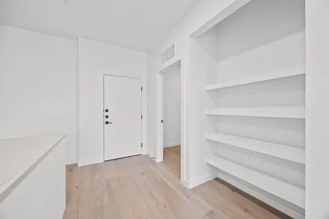 a view of an empty walk in closet