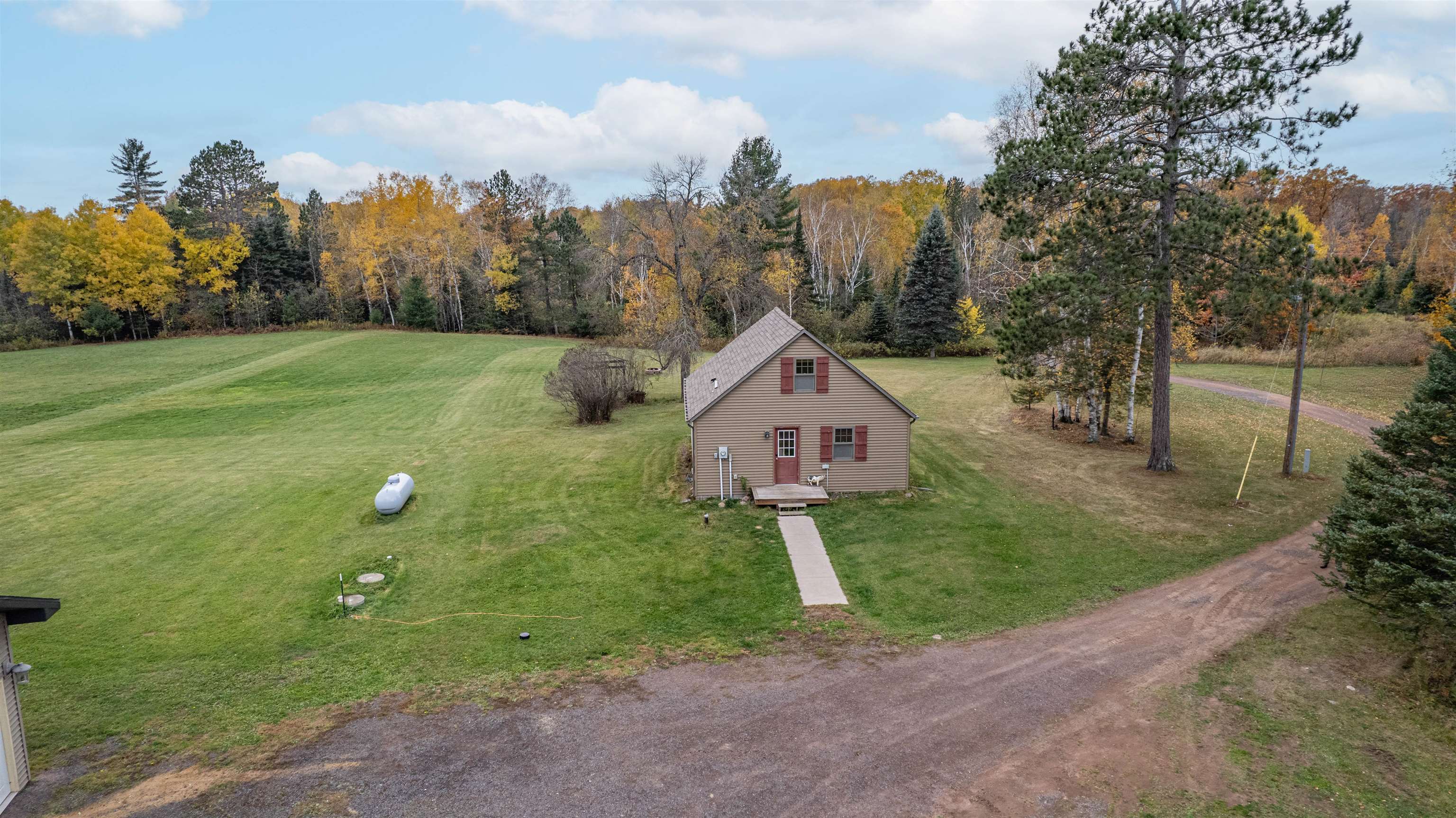 4202 Zachau Road Superior, WI 54880 - Photo 7 of 37 Aerial view of property and surrounding area featuring a heavily wooded area