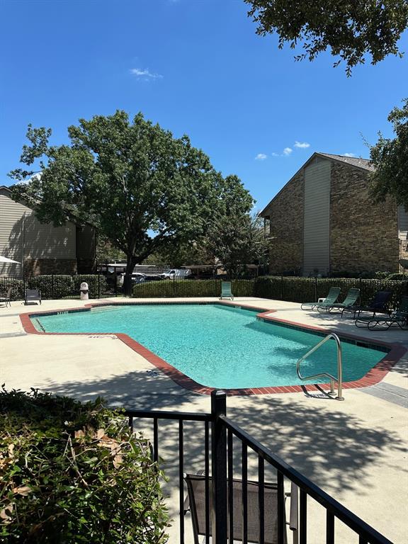 5300 Keller Springs Road, Unit 1090 Dallas, TX 75248 - Photo 10 of 10 Community pool featuring a patio and fence