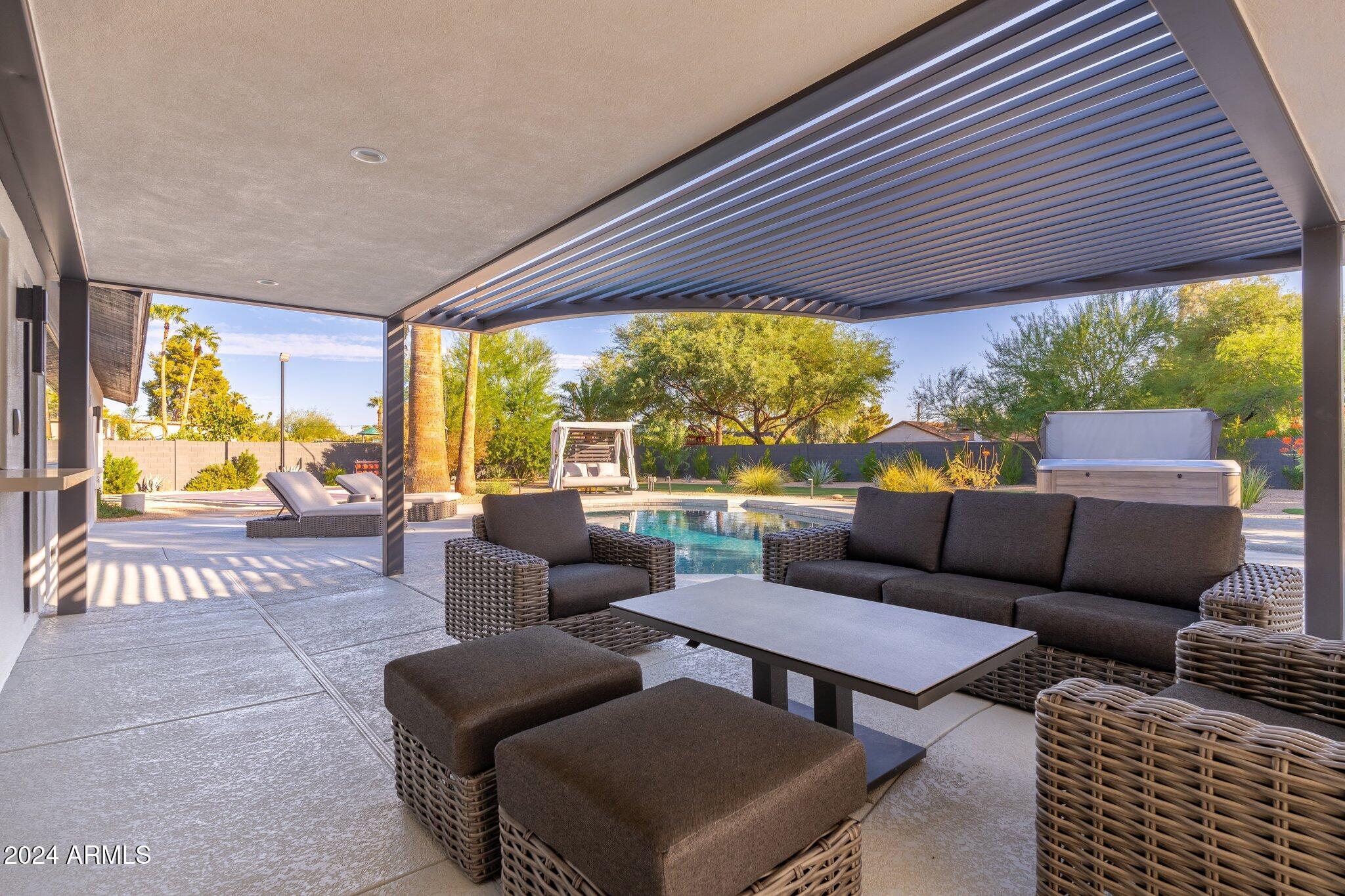 6025 East Charter Oak Road Scottsdale, AZ 85254 - Photo 103 of 115 a outdoor living space with furniture and a garden