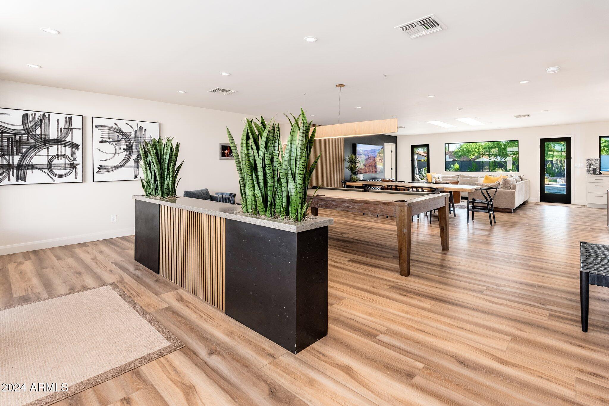 6025 East Charter Oak Road Scottsdale, AZ 85254 - Photo 15 of 115 a living room with furniture and a wooden floor