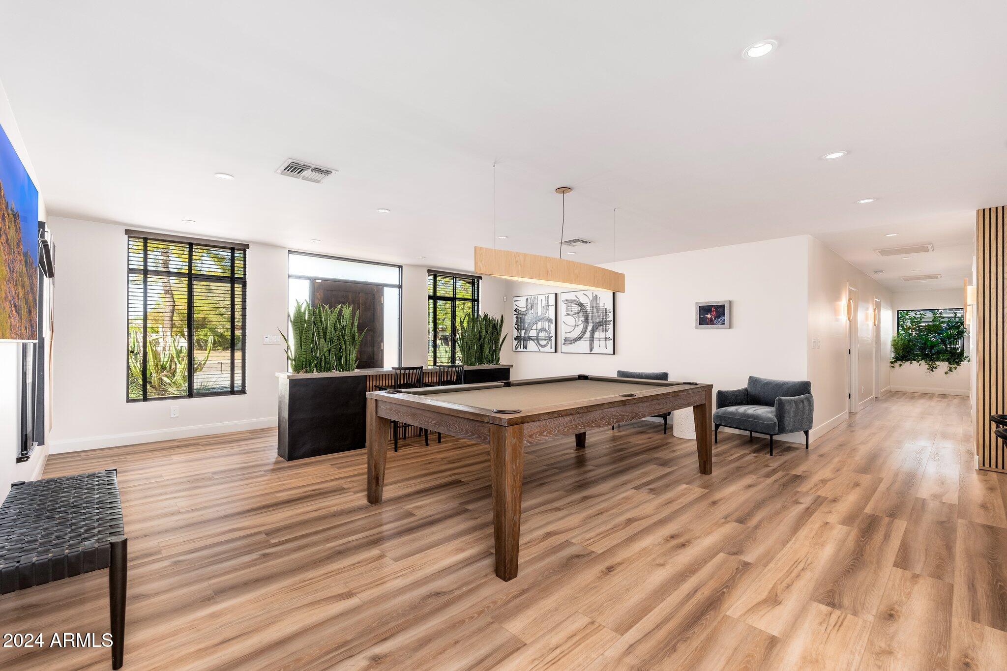 6025 East Charter Oak Road Scottsdale, AZ 85254 - Photo 17 of 115 a living room with furniture and a wooden floor