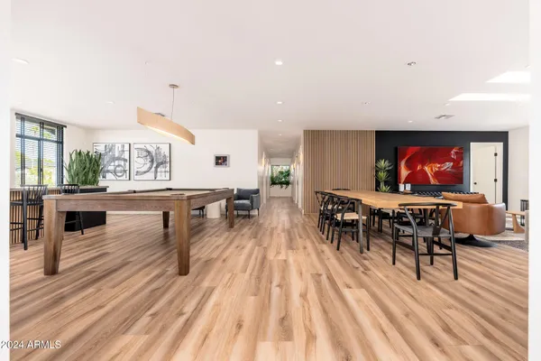a bathroom with double vanity a mirror a sink and a window