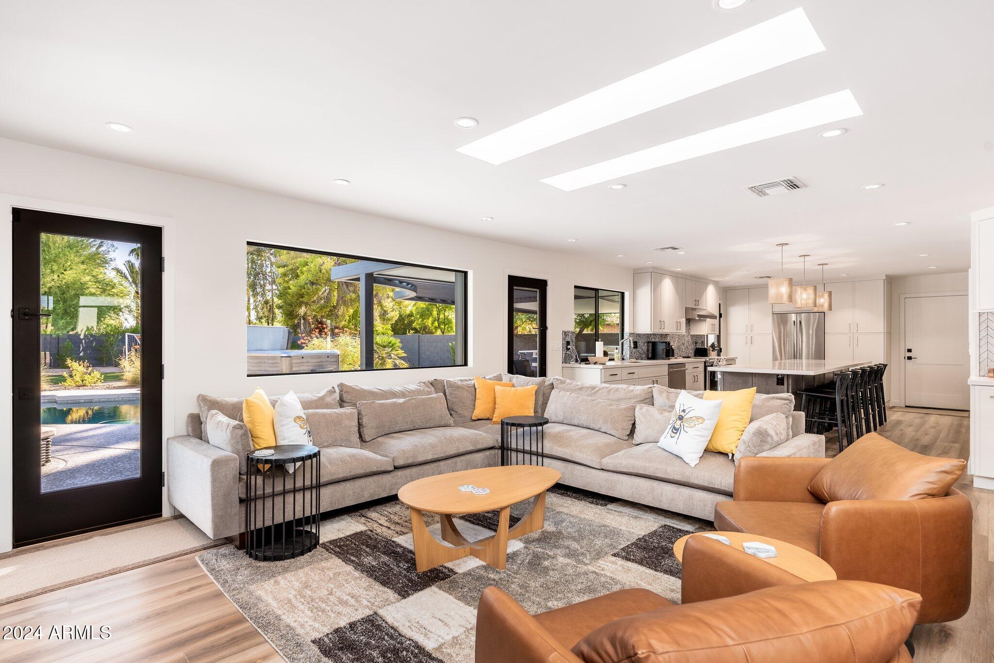 6025 East Charter Oak Road Scottsdale, AZ 85254 - Photo 21 of 115 a living room with furniture and a large window