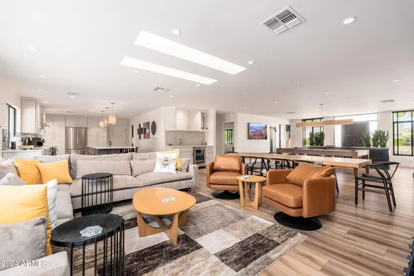 a spacious bedroom with a bed and a couch