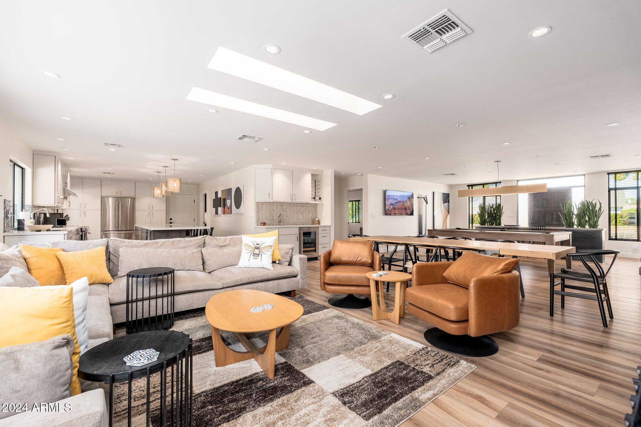 6025 East Charter Oak Road Scottsdale, AZ 85254 - Photo 22 of 115 a living room with furniture kitchen view and a table