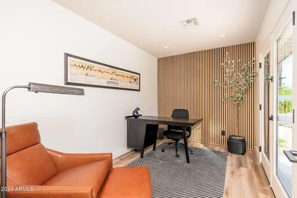 a view of a house with a backyard porch and sitting area