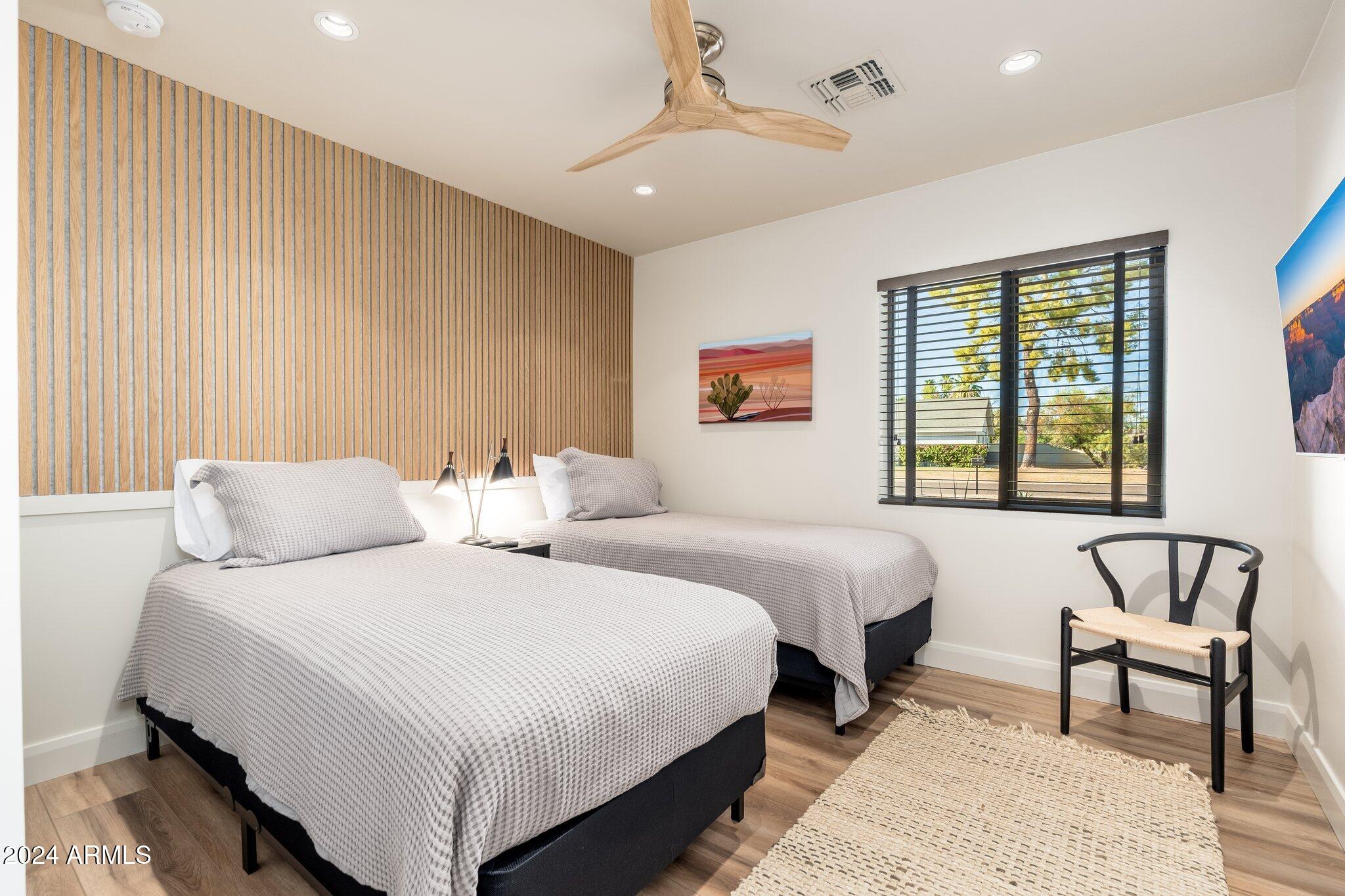 6025 East Charter Oak Road Scottsdale, AZ 85254 - Photo 34 of 115 a bedroom with bed and a window