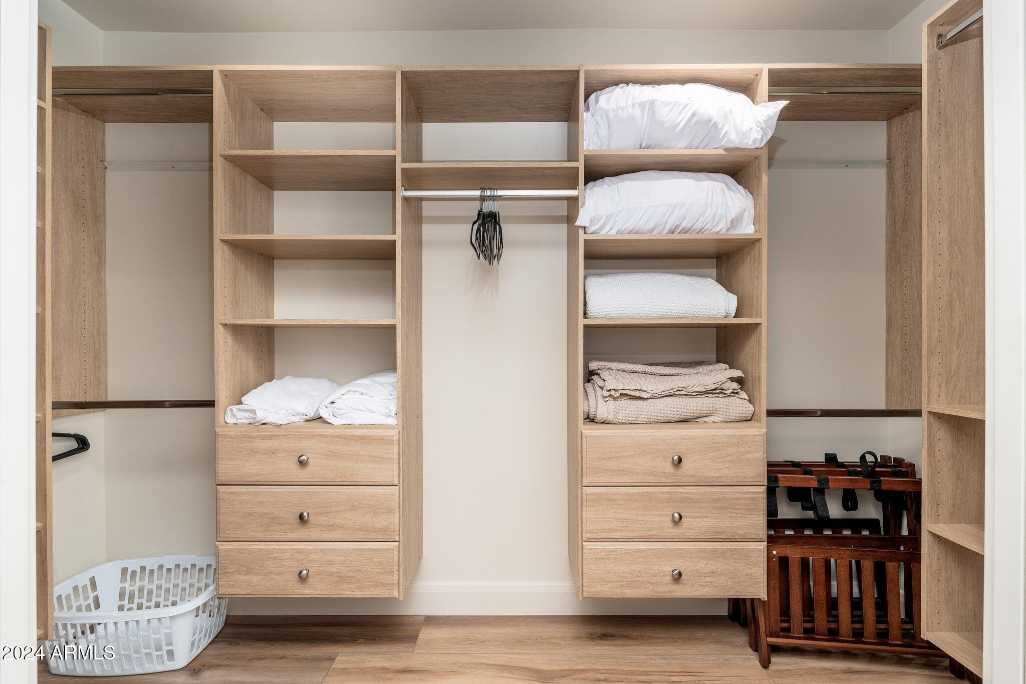6025 East Charter Oak Road Scottsdale, AZ 85254 - Photo 38 of 115 a view of walk in closet with clothes and shoes