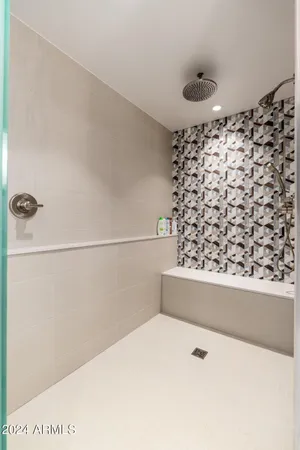 a kitchen with a sink and large cabinets