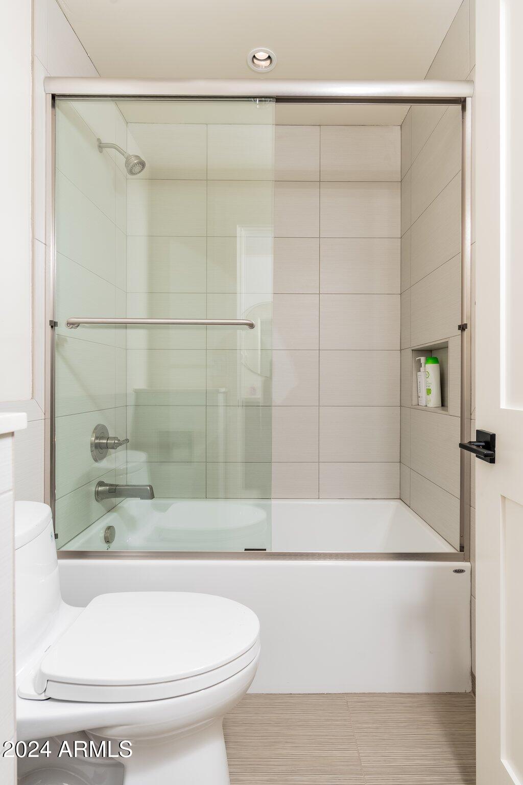 6025 East Charter Oak Road Scottsdale, AZ 85254 - Photo 46 of 115 a bathroom with a bathtub and a shower