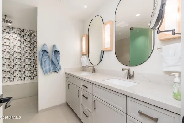 a view of a swimming pool with a table and chairs