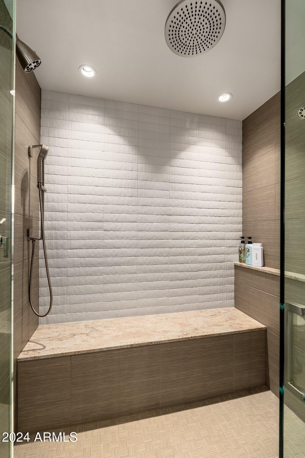 6025 East Charter Oak Road Scottsdale, AZ 85254 - Photo 50 of 115 a bathroom with a bathtub and a shower