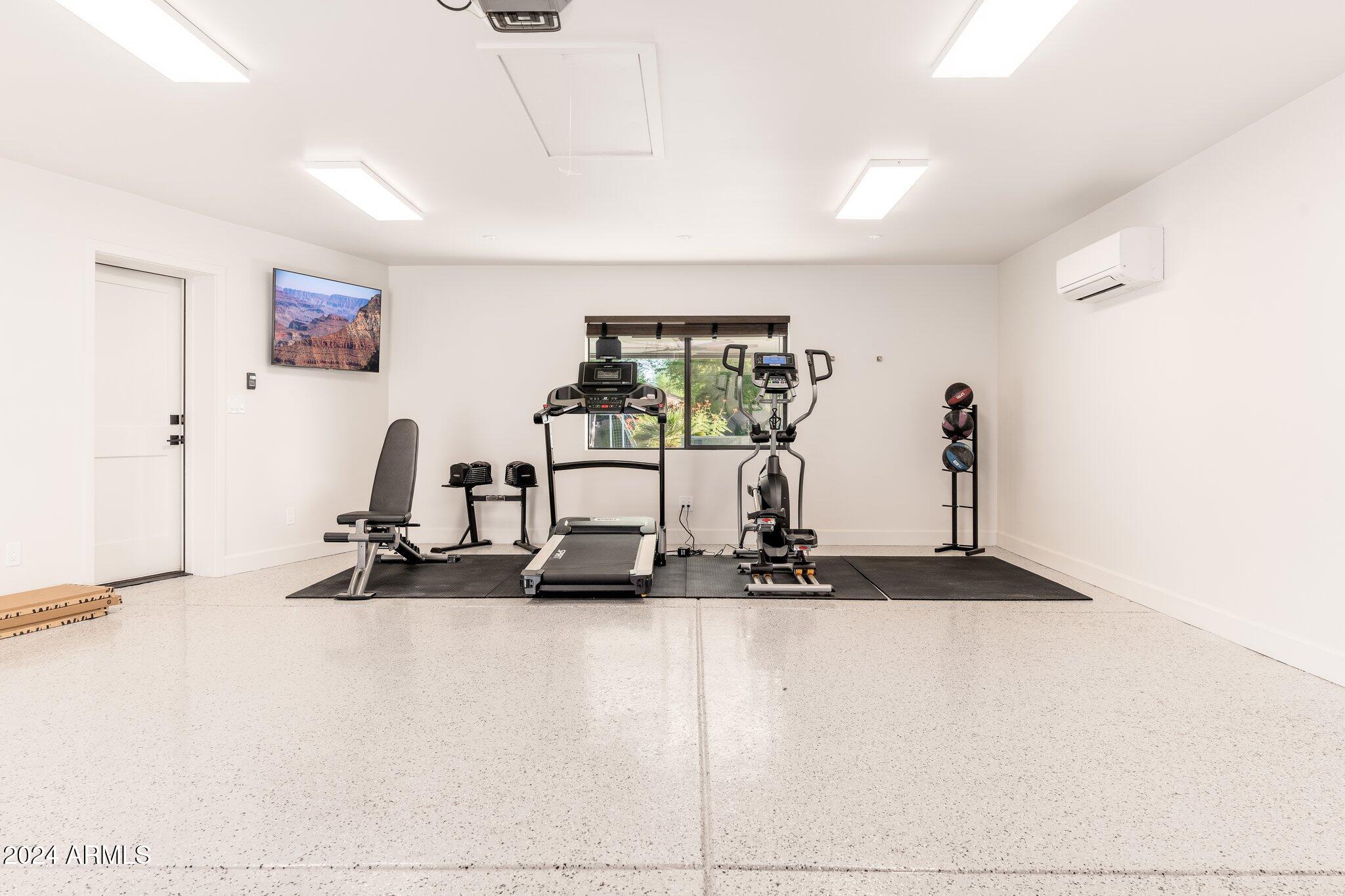 6025 East Charter Oak Road Scottsdale, AZ 85254 - Photo 51 of 115 a view of a room with gym equipment
