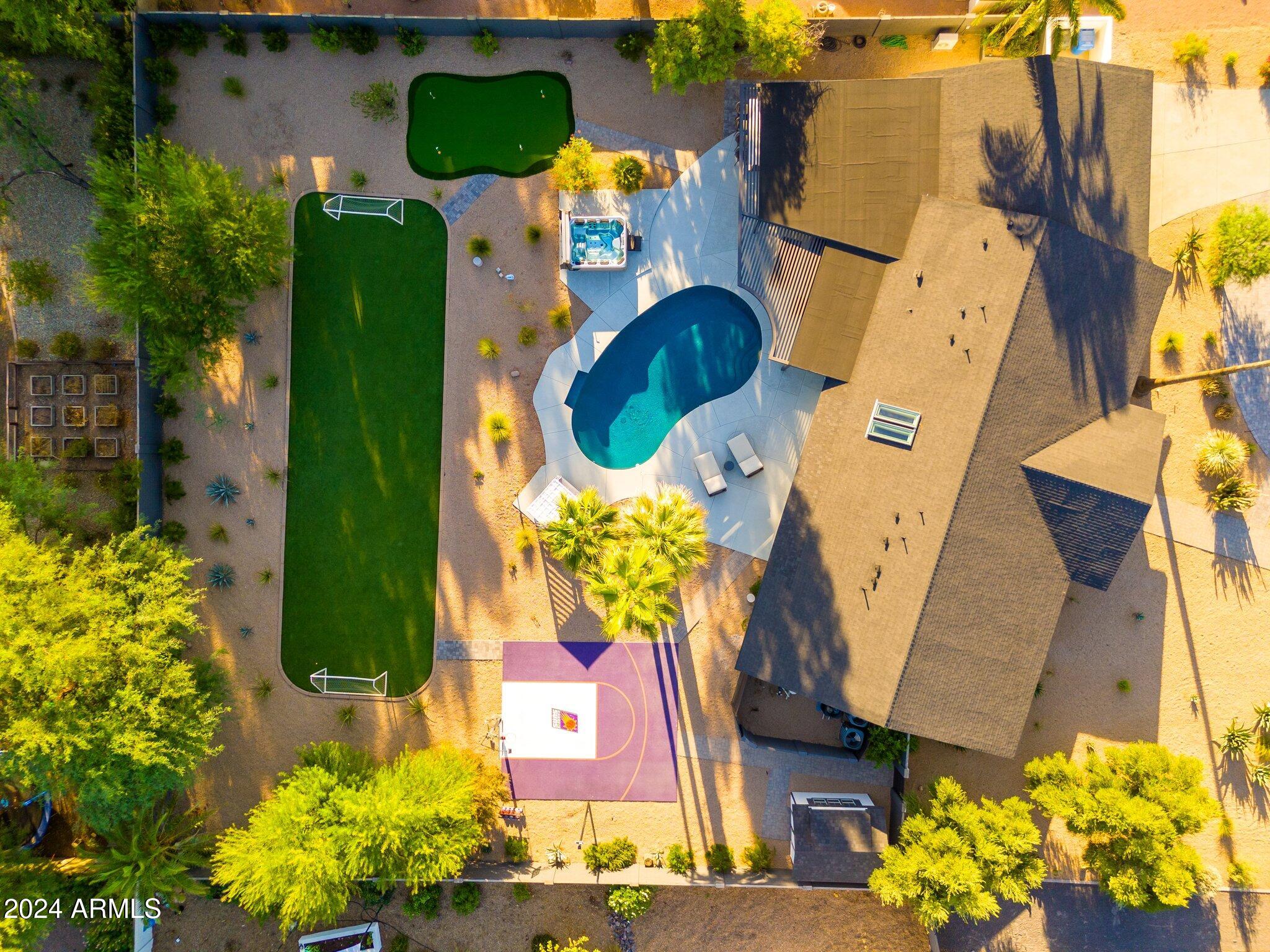 6025 East Charter Oak Road Scottsdale, AZ 85254 - Photo 52 of 115 an aerial view of residential house with outdoor space and swimming pool