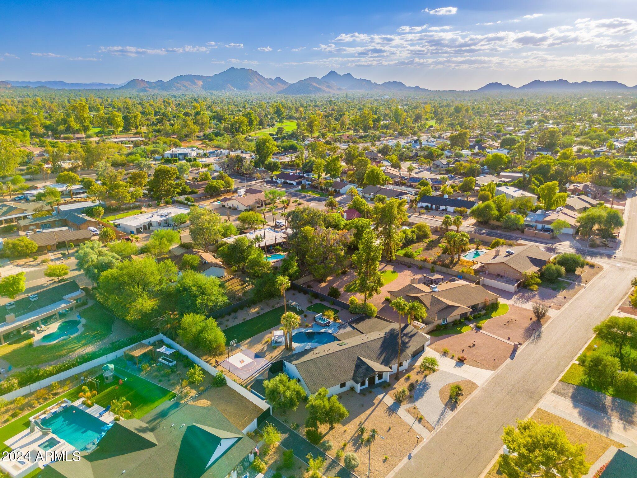 6025 East Charter Oak Road Scottsdale, AZ 85254 - Photo 55 of 115 an aerial view of residential houses with outdoor space
