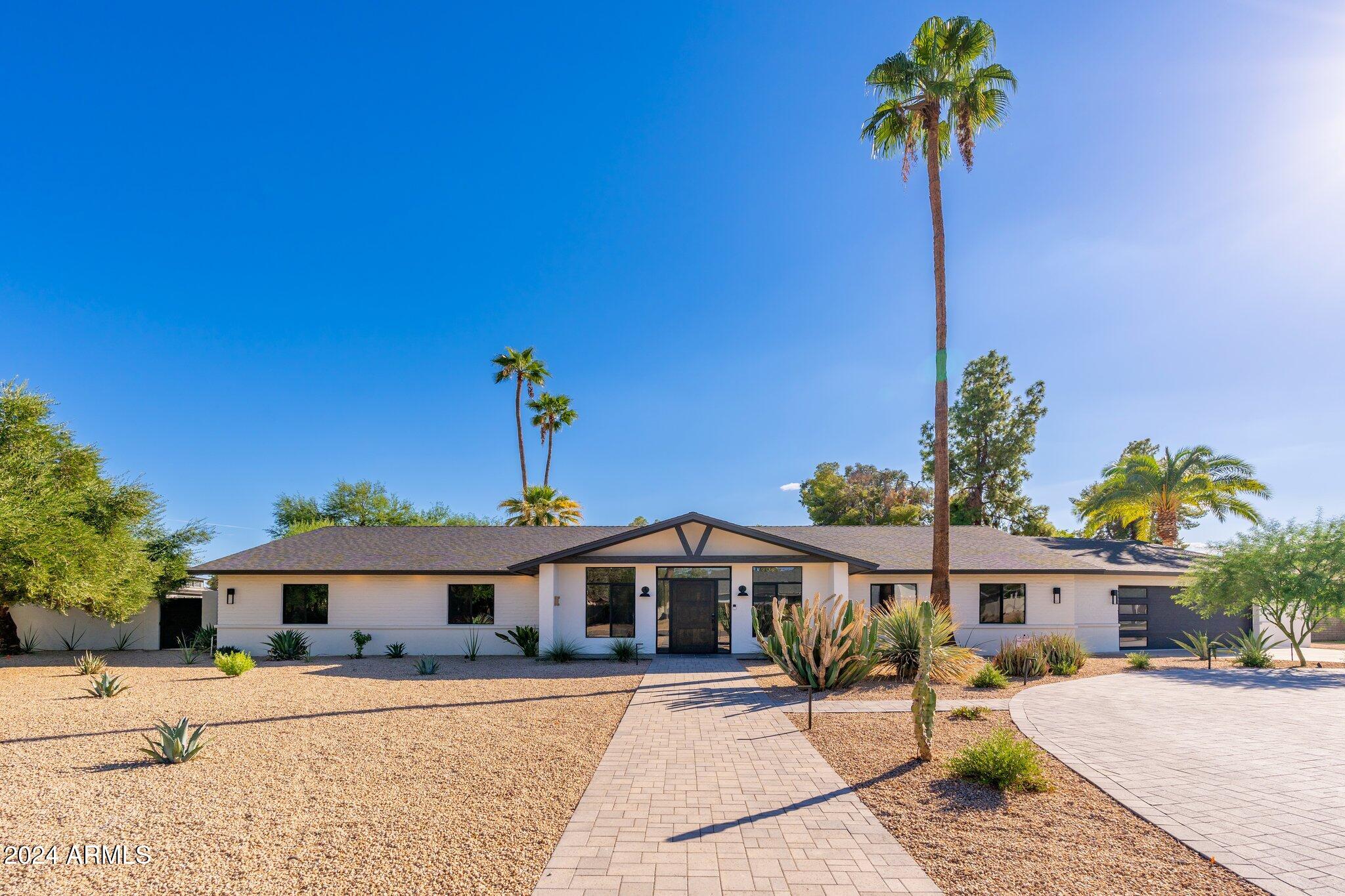 6025 East Charter Oak Road Scottsdale, AZ 85254 - Photo 95 of 115 a front view of a house with a porch