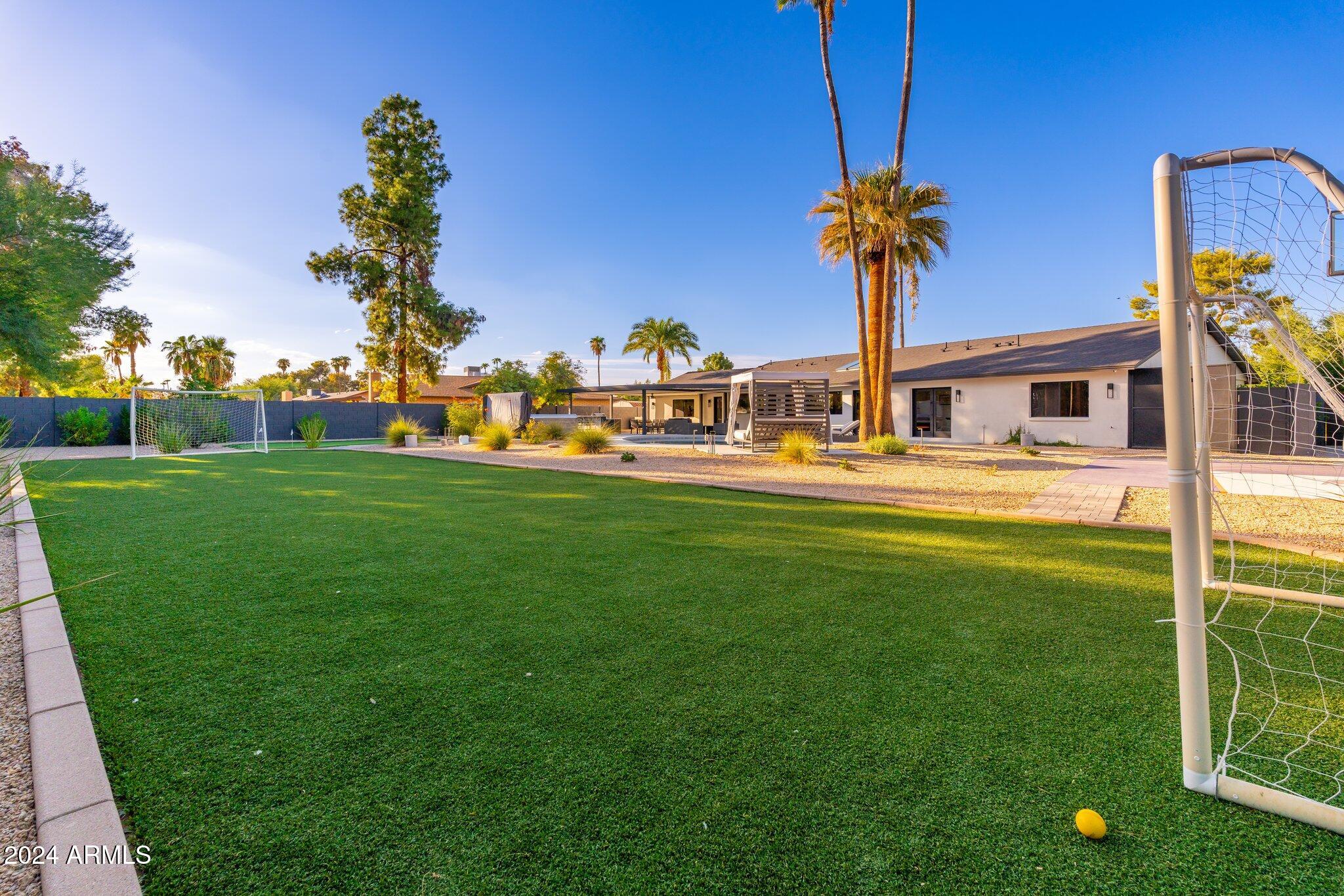 6025 East Charter Oak Road Scottsdale, AZ 85254 - Photo 96 of 115 a view of a house with a big yard