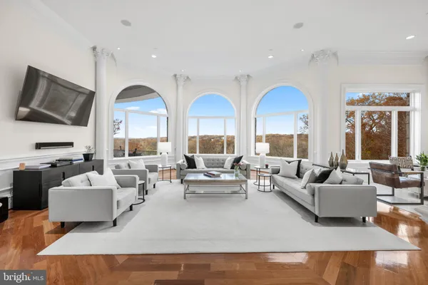 a living room with furniture fireplace and a flat screen tv