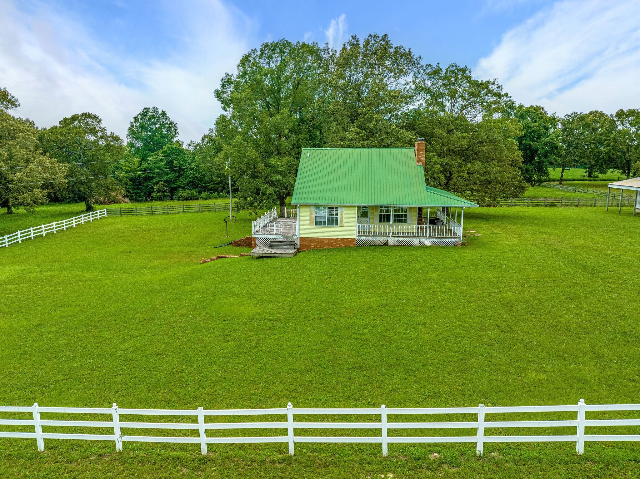 2385 Sylvia Road Dickson, TN 37055 - Photo 15 of 46 a front view of a house with a yard table and chairs