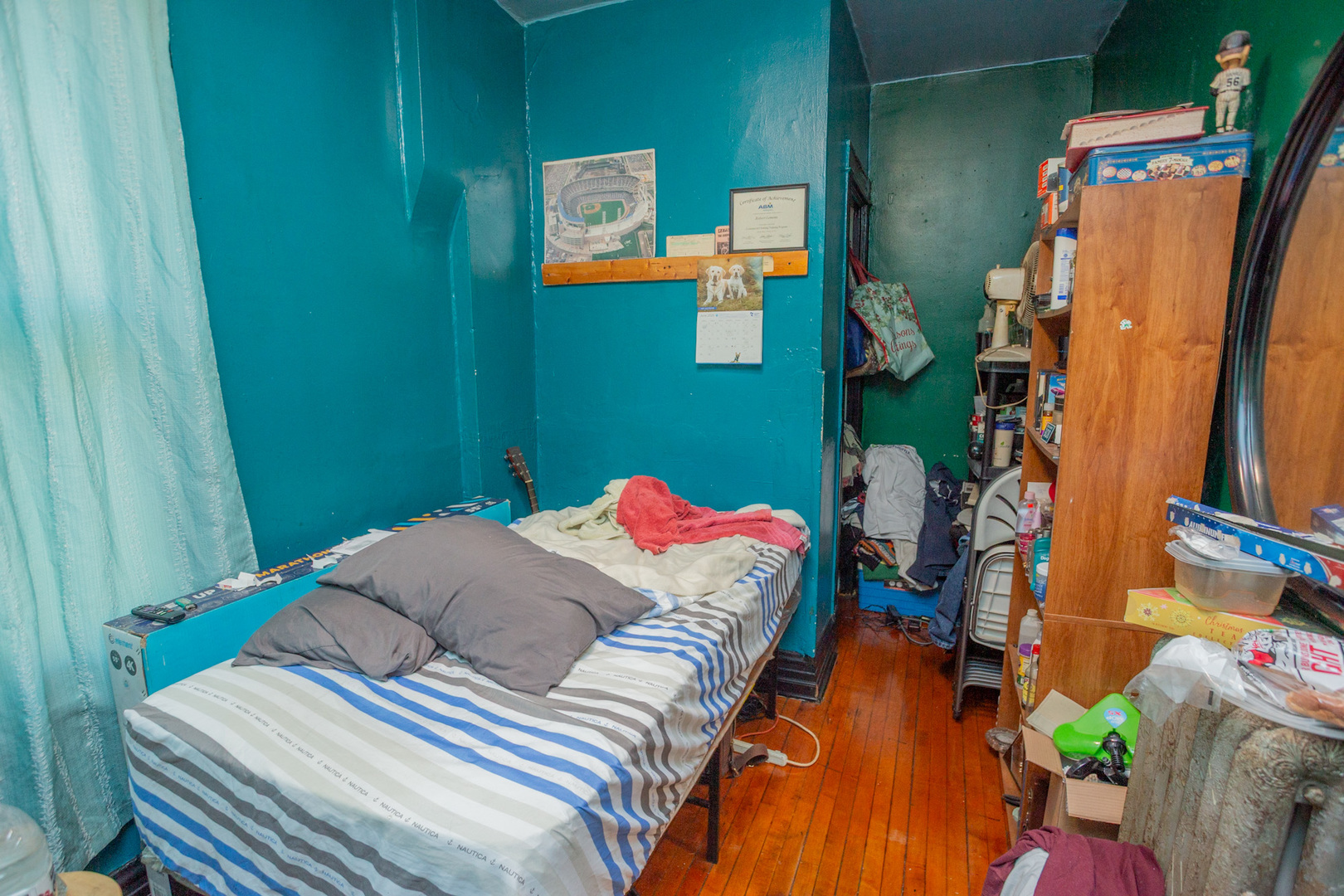 6049 South Champlain Avenue Chicago, IL 60637 - Photo 15 of 46 a bedroom with a bed and a window