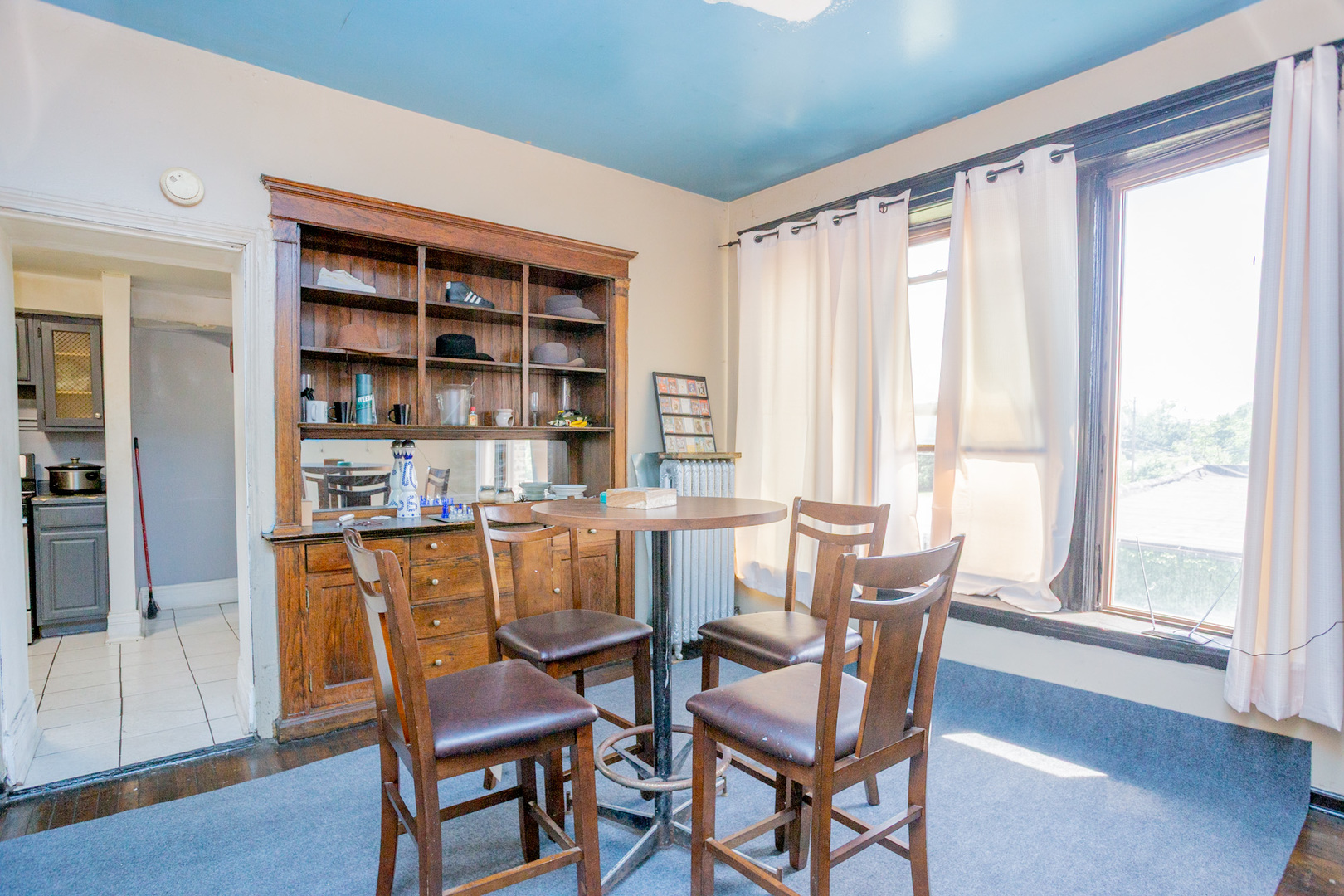 6049 South Champlain Avenue Chicago, IL 60637 - Photo 19 of 46 a view of a dining room with furniture and a window
