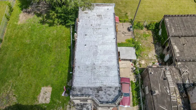 an aerial view of residential houses with outdoor space
