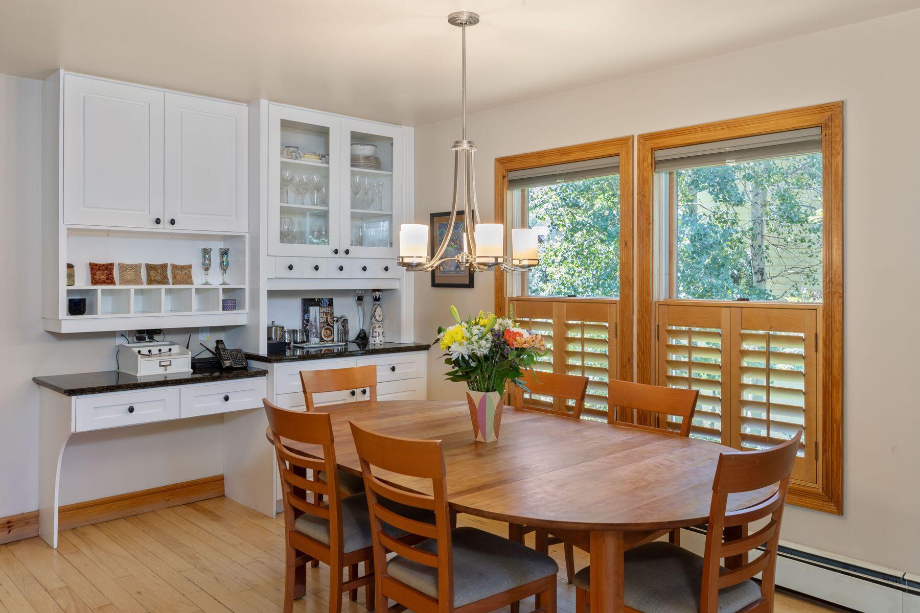 239 North Davis Street Telluride, CO 81435 - Photo 14 of 42 a view of a dining room with furniture window and wooden floor