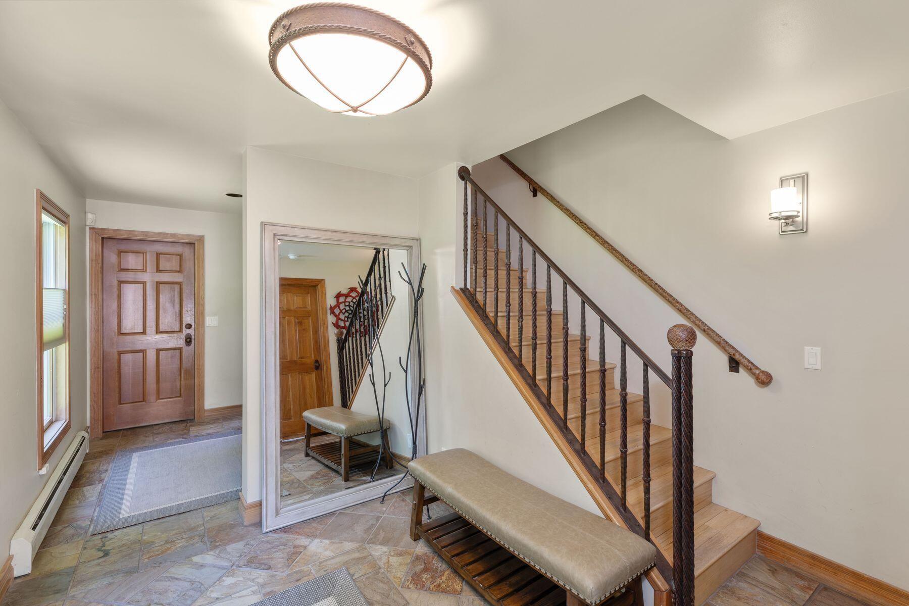239 North Davis Street Telluride, CO 81435 - Photo 3 of 42 a view of a hallway with closet and stairs