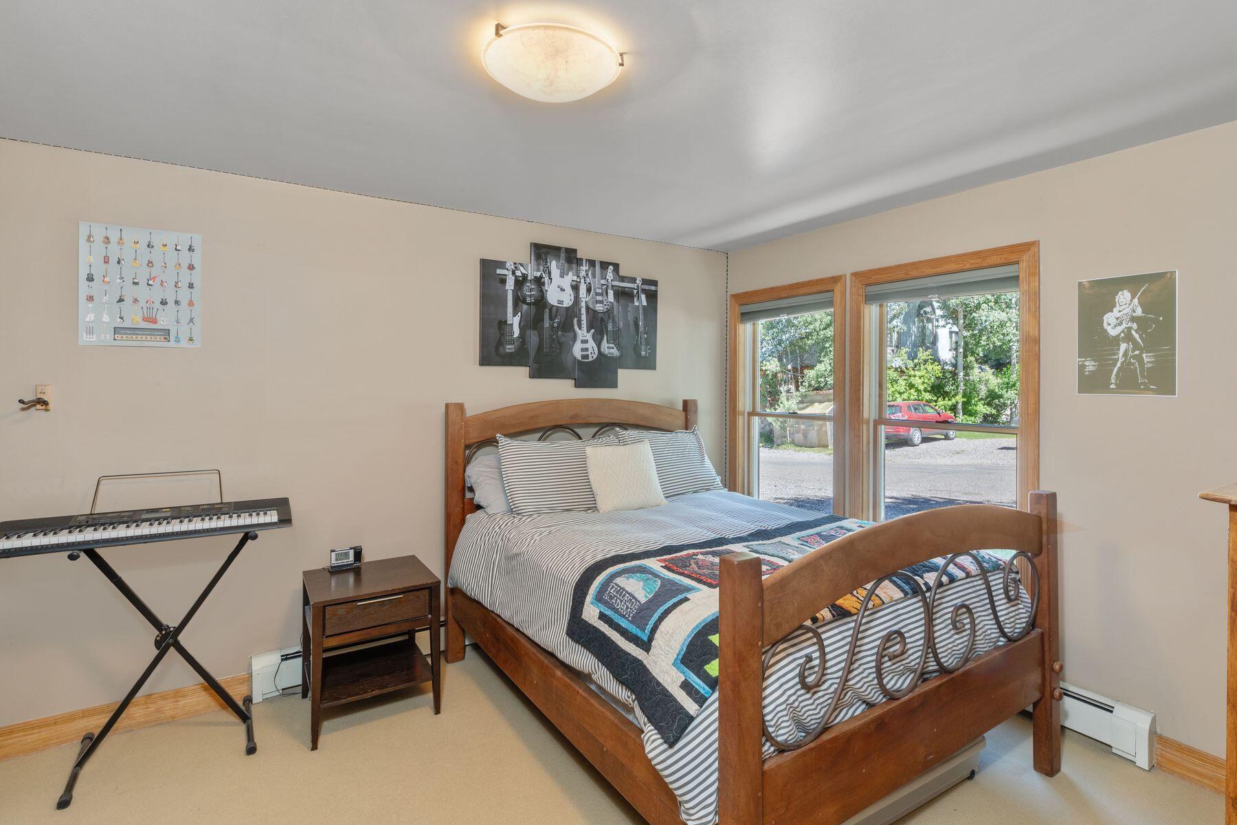 239 North Davis Street Telluride, CO 81435 - Photo 4 of 42 a bedroom with a bed and a window