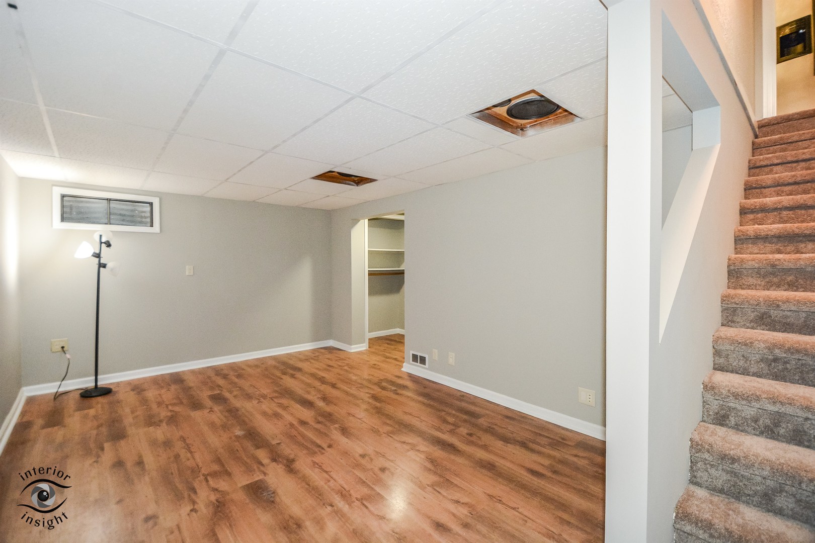 266 Circlegate Road New Lenox, IL 60451 - Photo 12 of 25 a view of a livingroom with wooden floor and staircase