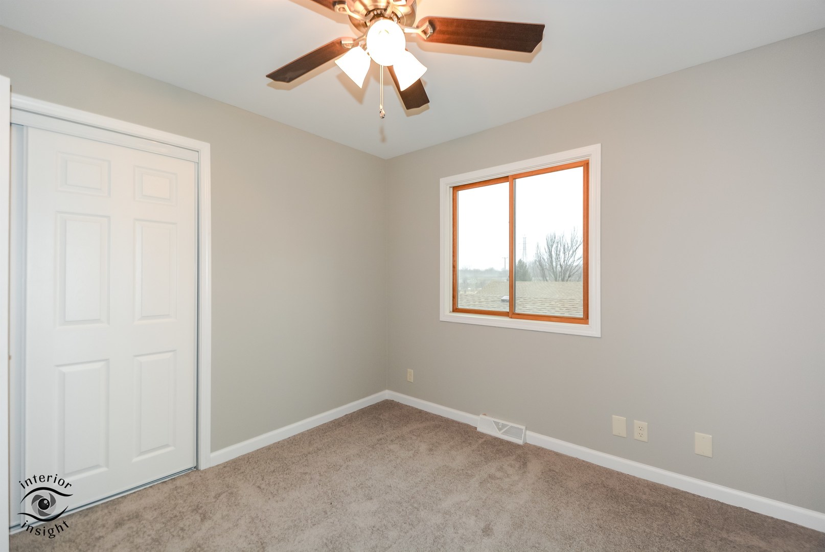 266 Circlegate Road New Lenox, IL 60451 - Photo 19 of 25 an empty room with windows and chandelier fan