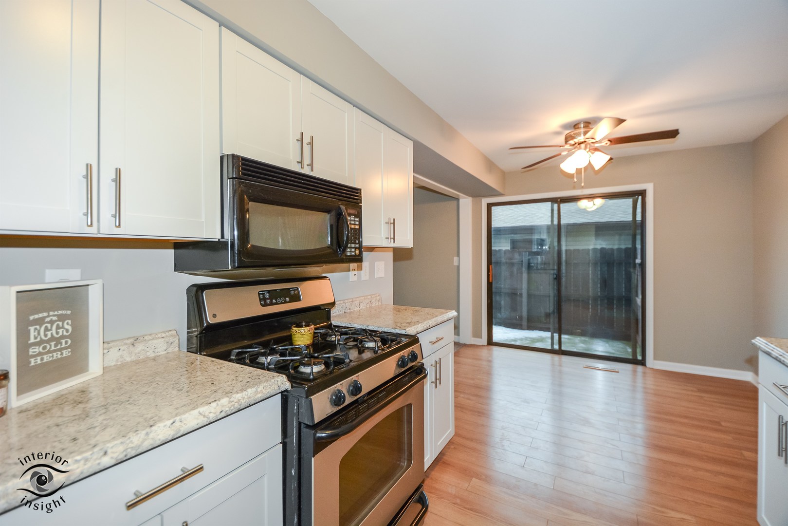 266 Circlegate Road New Lenox, IL 60451 - Photo 10 of 25 a kitchen with stainless steel appliances granite countertop a stove a sink and a microwave