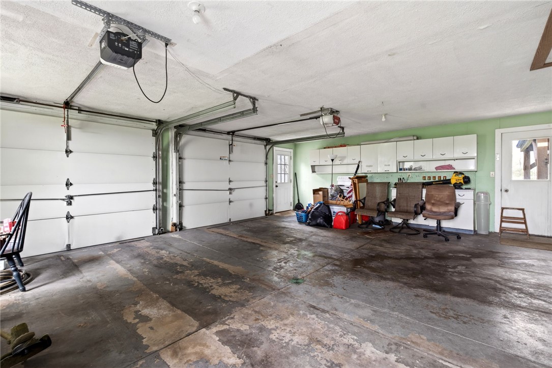 7988 McCool Road Greenville, OH 45331 - Photo 24 of 50 This spacious garage offers ample storage and utility with dual access doors.