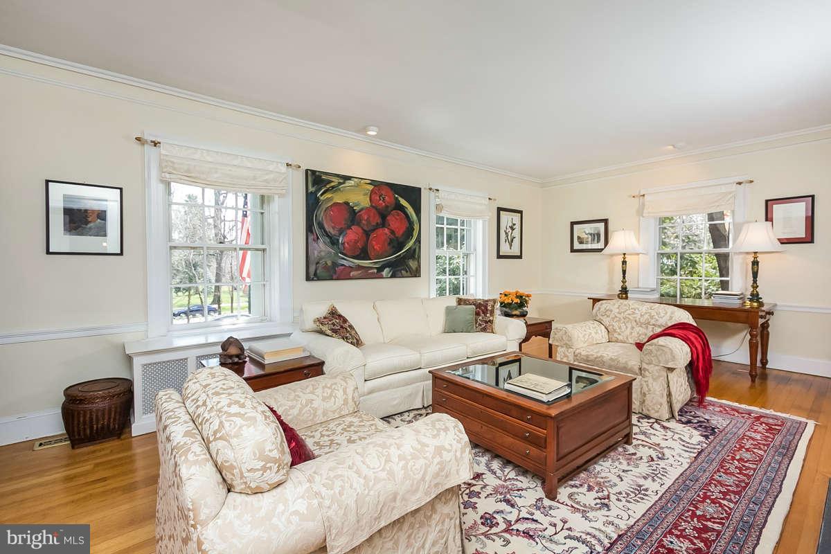 14 East Bishops Road Baltimore, MD 21218 - Photo 2 of 28 a living room with furniture a flat screen tv and a window