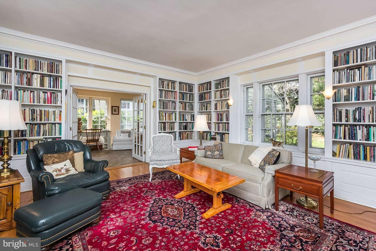 14 East Bishops Road Baltimore, MD 21218 - Photo 12 of 28 a living room with furniture a bookshelf and a table