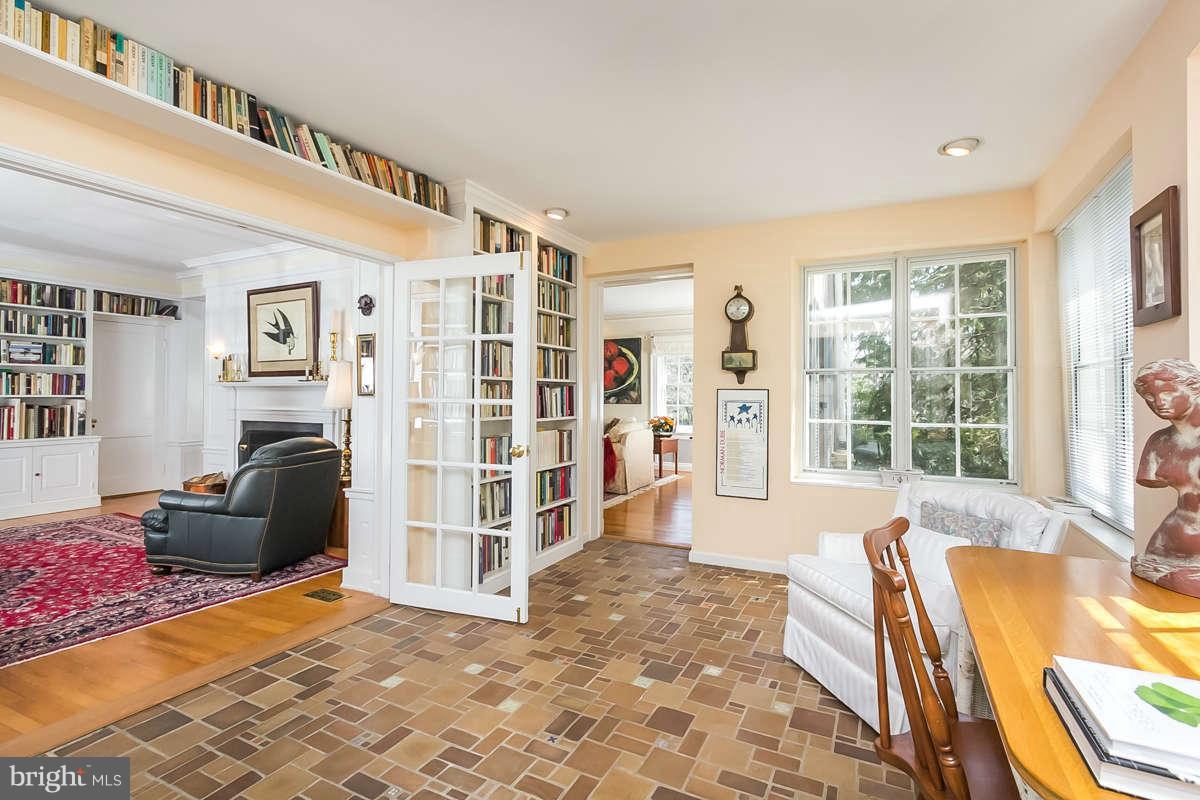 14 East Bishops Road Baltimore, MD 21218 - Photo 13 of 28 a living room with furniture and a floor to ceiling window
