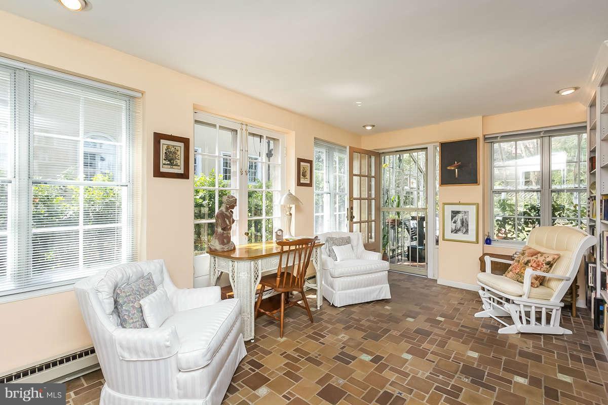 14 East Bishops Road Baltimore, MD 21218 - Photo 14 of 28 a living room with furniture and a large window