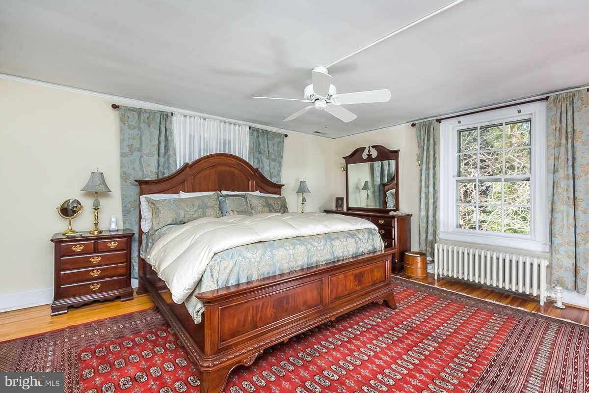 14 East Bishops Road Baltimore, MD 21218 - Photo 18 of 28 a bedroom with a bed and a window