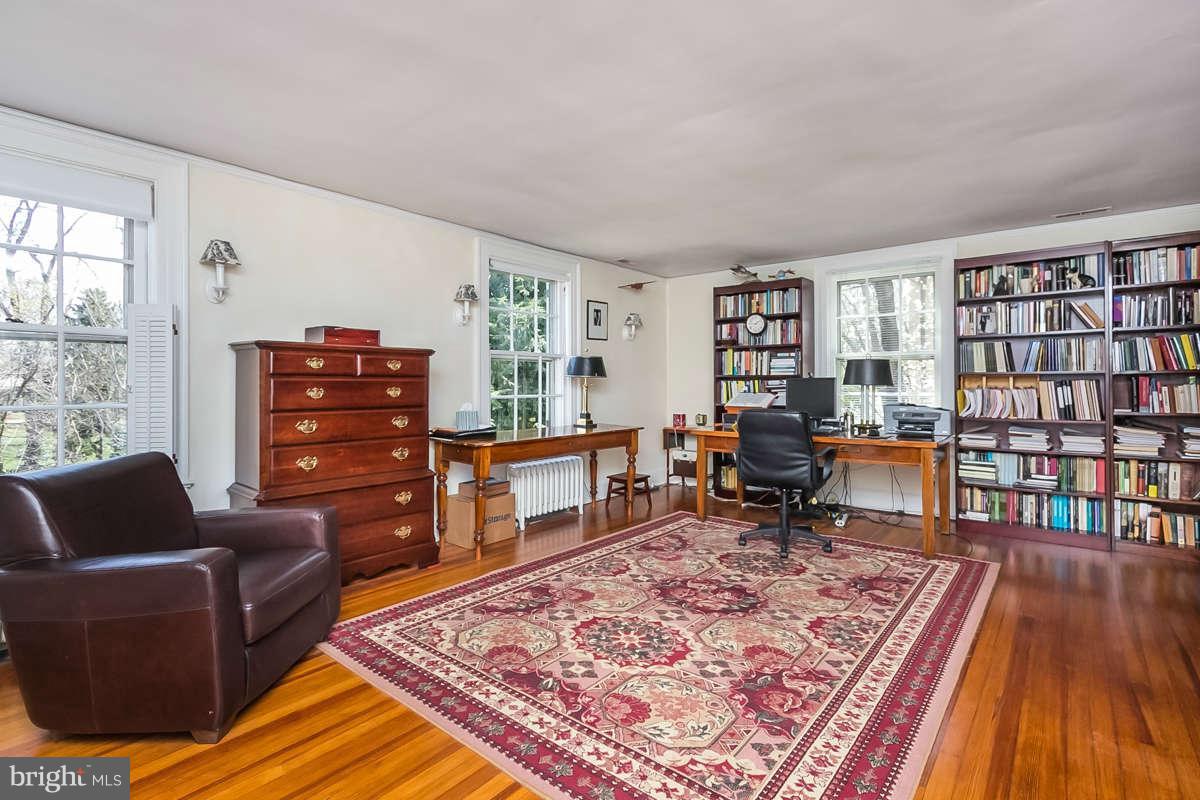 14 East Bishops Road Baltimore, MD 21218 - Photo 20 of 28 a living room with furniture and a wooden floor