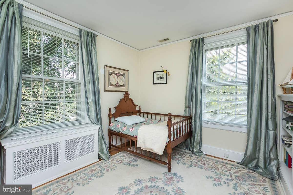 14 East Bishops Road Baltimore, MD 21218 - Photo 25 of 28 a bedroom with a bed and a window