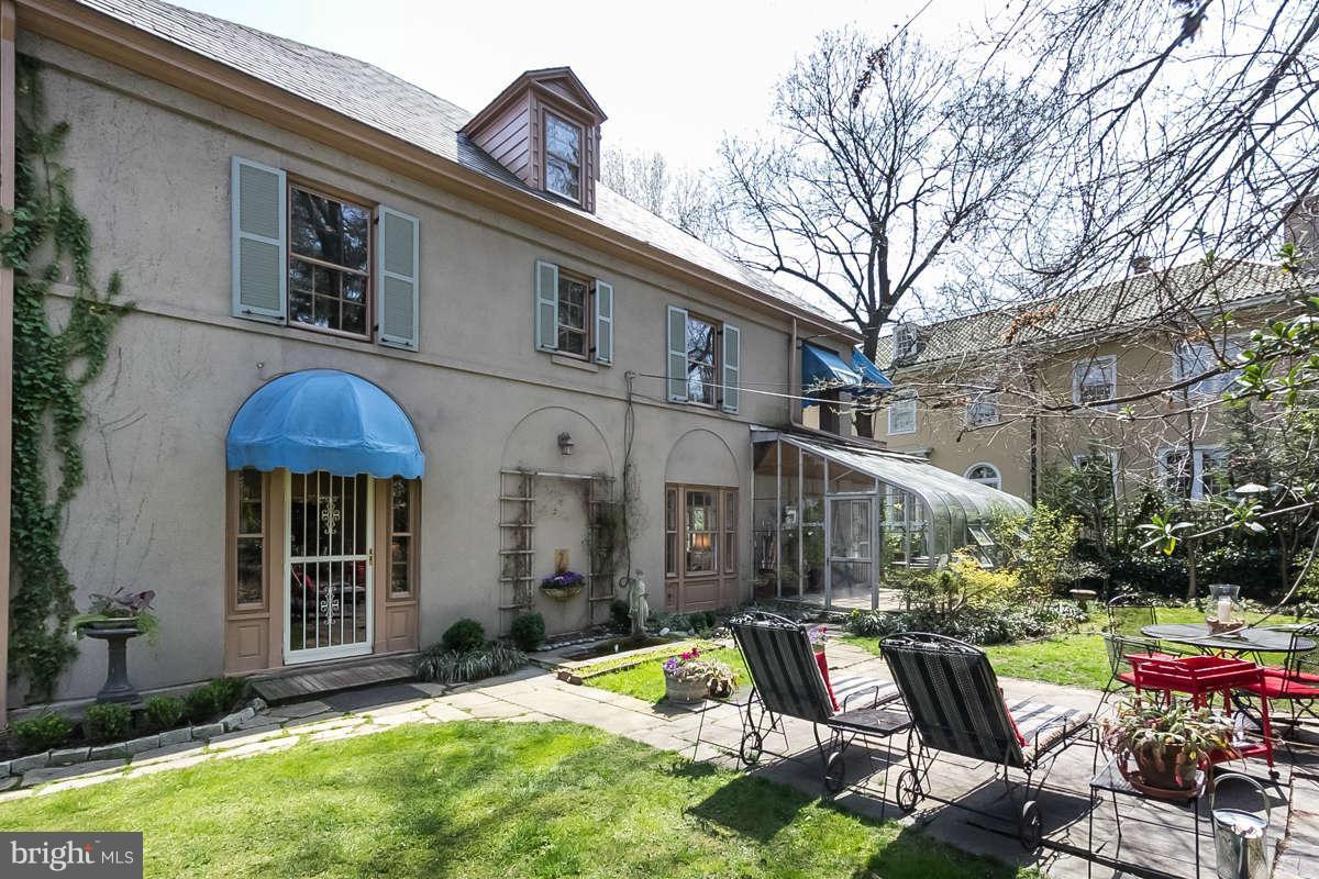14 East Bishops Road Baltimore, MD 21218 - Photo 26 of 28 a view of backyard with wheel chair and potted plants